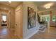 Bright hallway with stairs and large piece of art at 82 Byrd Ln, Pittsboro, NC 27312