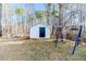 Backyard with shed, grassy area, and swing set at 902 Cobb Ct, Sanford, NC 27330