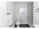 Bathroom with walk-in shower, toilet and window at 902 Cobb Ct, Sanford, NC 27330