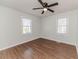 Spacious bedroom with hardwood floors and two windows at 902 Cobb Ct, Sanford, NC 27330