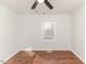 Well-lit bedroom featuring hardwood floors and a window at 902 Cobb Ct, Sanford, NC 27330