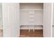 Spacious closet with built-in shelves and hardwood flooring at 902 Cobb Ct, Sanford, NC 27330