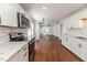 Open concept kitchen features stainless steel appliances and luxury vinyl plank flooring at 902 Cobb Ct, Sanford, NC 27330