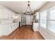 Modern kitchen with white cabinets and chandelier at 902 Cobb Ct, Sanford, NC 27330