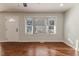 Living room with hardwood floors and bay window at 902 Cobb Ct, Sanford, NC 27330