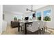 Bright dining area with large windows and seating for six at 937 Selby Ave, Durham, NC 27713