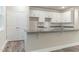 Modern kitchen with white cabinets, granite countertops, and an island at Lot 14H Poppy Mallow Ln, Oxford, NC 27565