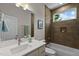 Modern bathroom featuring stone shower, and unique sink at 100 A Masondale Ave, Durham, NC 27707