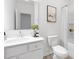 Elegant bathroom features a white vanity, modern art, and shower with white curtain at 100 Sequoia Dr # 2387, Louisburg, NC 27549
