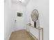 Bright foyer with stylish console table, mirror, and modern decor accents at 100 Sequoia Dr # 2387, Louisburg, NC 27549