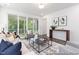 Living room showcasing a neutral color palette and access to a balcony at 100 Sequoia Dr # 2387, Louisburg, NC 27549