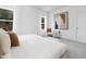 Comfortable main bedroom with plush carpet, large window, and modern artwork at 100 Sequoia Dr # 2387, Louisburg, NC 27549