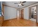 Bedroom with hardwood floors and access to the bathroom at 1018 Lakeview Dr, Cedar Grove, NC 27231