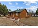 Log cabin with stone walkway and deck at 1018 Lakeview Dr, Cedar Grove, NC 27231
