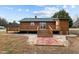 Log cabin with large deck and patio at 1018 Lakeview Dr, Cedar Grove, NC 27231