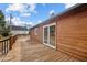 View of log cabin from deck, showcasing large windows at 1018 Lakeview Dr, Cedar Grove, NC 27231