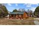 Rustic log cabin home with a spacious yard at 1018 Lakeview Dr, Cedar Grove, NC 27231