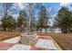 Landscaped fire pit area with stone fire pit and pavers at 1018 Lakeview Dr, Cedar Grove, NC 27231