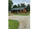 Charming single-story home with well-maintained landscaping and a gravel driveway at 1018 Lakeview Dr, Cedar Grove, NC 27231