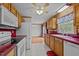 Kitchen with oak cabinets, red tile countertops, and stainless steel appliances at 1018 Lakeview Dr, Cedar Grove, NC 27231