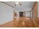 Hardwood floor living room with wood walls and fireplace at 1018 Lakeview Dr, Cedar Grove, NC 27231