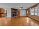 Spacious living room featuring hardwood floors, a wood-burning fireplace, and lots of natural light at 1018 Lakeview Dr, Cedar Grove, NC 27231