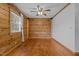 Simple spare bedroom with hardwood floors and wood walls at 1018 Lakeview Dr, Cedar Grove, NC 27231