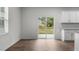 Sliding glass doors from kitchen open to a backyard patio at 1025 Middlecrest Dr, Rocky Mount, NC 27804