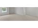 Spacious carpeted bedroom with large window at 1025 Middlecrest Dr, Rocky Mount, NC 27804