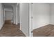 Bright hallway with light brown wood-look floors at 1025 Middlecrest Dr, Rocky Mount, NC 27804