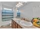 Bathroom boasts double sinks with granite counters, neutral walls, and tiled floor at 108 Bonnie Girl Ct, Lillington, NC 27546
