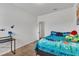 bedroom with brightly colored blanket and natural light at 108 Bonnie Girl Ct, Lillington, NC 27546