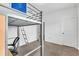 Bedroom features a loft bed with ladder, desk and chair, carpet, and doors at 108 Bonnie Girl Ct, Lillington, NC 27546