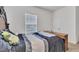 Well-lit bedroom featuring a comfortable bed, carpet and natural light at 108 Bonnie Girl Ct, Lillington, NC 27546