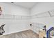 Walk-in closet features wire shelving and carpet, plus a utility cart at 108 Bonnie Girl Ct, Lillington, NC 27546