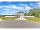 Exterior view of a two-story home featuring a driveway, front yard and white fence in the background at 108 Bonnie Girl Ct, Lillington, NC 27546