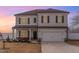 Two-story home featuring a front-facing two-car garage, gray siding, and dark shutters at 108 Bonnie Girl Ct, Lillington, NC 27546