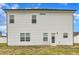 Exterior of a two-story home showcasing the siding and backyard at 108 Bonnie Girl Ct, Lillington, NC 27546