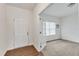 Foyer with a view into an office space featuring a doorway, gray carpet and white walls at 108 Bonnie Girl Ct, Lillington, NC 27546