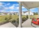 Relaxing front porch with comfortable seating, lush landscaping, and neighborhood views at 108 Bonnie Girl Ct, Lillington, NC 27546