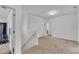 Neutral hallway with carpet flooring leading to multiple rooms at 108 Bonnie Girl Ct, Lillington, NC 27546