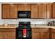 Well-lit kitchen with stainless steel appliances and speckled granite countertops at 108 Bonnie Girl Ct, Lillington, NC 27546