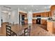Open kitchen showcases stainless steel appliances, and wooden cabinetry, blending style and functionality at 108 Bonnie Girl Ct, Lillington, NC 27546