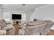 Comfortable living room boasts plush seating, a modern TV, and bright natural light at 108 Bonnie Girl Ct, Lillington, NC 27546