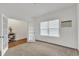 Office space with gray carpet, white walls, and view into foyer through glass french doors at 108 Bonnie Girl Ct, Lillington, NC 27546