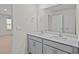 Double vanity bathroom with a large mirror and a view into a bedroom at 1104 Middlecrest Dr, Rocky Mount, NC 27804