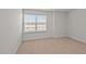 Bright bedroom with neutral colored carpet and a window with blinds at 1104 Middlecrest Dr, Rocky Mount, NC 27804