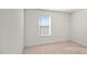Well-lit bedroom featuring a window with blinds at 1104 Middlecrest Dr, Rocky Mount, NC 27804