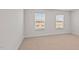 Bedroom with two windows and neutral decor at 1104 Middlecrest Dr, Rocky Mount, NC 27804