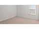 Simple carpeted bedroom with a window at 1104 Middlecrest Dr, Rocky Mount, NC 27804